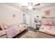 Cute ' bedroom with two twin beds, wood-look flooring, and plenty of space to play at 13959 W Country Gables Dr, Surprise, AZ 85379