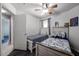 Shared ' bedroom with twin beds, wood-look flooring, and a closet for storage at 13959 W Country Gables Dr, Surprise, AZ 85379
