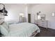 Well-lit bedroom featuring wood-look floors, neutral decor, and versatile furniture at 13959 W Country Gables Dr, Surprise, AZ 85379