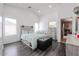 Charming bedroom with stylish gray-washed furniture, wood-look floors, and plenty of space at 13959 W Country Gables Dr, Surprise, AZ 85379