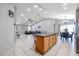 Open kitchen overlooking the living area, featuring an island with bar seating at 13959 W Country Gables Dr, Surprise, AZ 85379