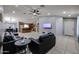 Open-concept living room featuring tile floors, recessed lighting, and a neutral color palette at 13959 W Country Gables Dr, Surprise, AZ 85379