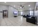 Open-concept living area with tile flooring and a neutral color scheme at 13959 W Country Gables Dr, Surprise, AZ 85379