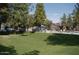 Well-maintained community grounds offer shaded areas and access to the community pool at 14002 N 49Th Ave # 1021, Glendale, AZ 85306