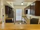 Well-lit kitchen features a window, appliances, and ample cabinet space at 14002 N 49Th Ave # 1021, Glendale, AZ 85306