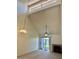 Spacious living room with high ceilings, fireplace, and sliding glass doors at 14002 N 49Th Ave # 1021, Glendale, AZ 85306