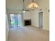Inviting living room with natural light, fireplace, and access to the outdoor area at 14002 N 49Th Ave # 1021, Glendale, AZ 85306