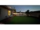 Backyard featuring a well-maintained pool, artificial turf, and covered patio at 16426 N 49Th St, Scottsdale, AZ 85254