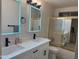 Bathroom featuring double sinks with backlit mirrors and shower at 16426 N 49Th St, Scottsdale, AZ 85254