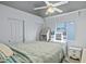 Bright bedroom features a ceiling fan, closet, window, and vanity area at 16426 N 49Th St, Scottsdale, AZ 85254