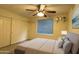 This bedroom has closet, shelves, large window and a plush bed, creating a cozy and inviting space at 16426 N 49Th St, Scottsdale, AZ 85254