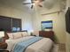 Bedroom featuring a bed with blue accents and a large window at 16426 N 49Th St, Scottsdale, AZ 85254