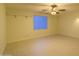 Spacious and versatile room with tiled flooring and a large window, perfect for customization at 16426 N 49Th St, Scottsdale, AZ 85254