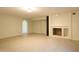 A spacious and versatile room with neutral tones, a cozy fireplace, and arched doorways perfect for customization at 16426 N 49Th St, Scottsdale, AZ 85254