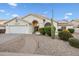 Inviting single-story home featuring a desert-landscaped front yard with a brick walkway at 16426 N 49Th St, Scottsdale, AZ 85254