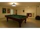 A fun game room with pool table, fireplace, and decor perfect for entertaining guests and enjoying leisure time at 16426 N 49Th St, Scottsdale, AZ 85254