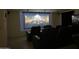 A home theater room with comfortable seating and a large projection screen at 16426 N 49Th St, Scottsdale, AZ 85254