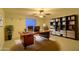 A professional home office with custom built-ins, a large desk, and ample natural light for work at 16426 N 49Th St, Scottsdale, AZ 85254