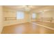 Bright dance studio with mirrored wall, barre, laminate flooring, and natural light perfect for fitness at 16426 N 49Th St, Scottsdale, AZ 85254