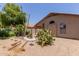 Landscaped backyard featuring desert landscaping and privacy at 1858 N 128Th Dr, Avondale, AZ 85392
