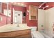 Bathroom with a vanity, mirror, toilet and tub/shower combination with red walls at 1858 N 128Th Dr, Avondale, AZ 85392