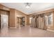 Primary bedroom featuring tile floors, neutral walls, and a mirror closet at 1858 N 128Th Dr, Avondale, AZ 85392