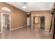 Primary bedroom featuring tile floors, neutral walls, and a mirror closet at 1858 N 128Th Dr, Avondale, AZ 85392
