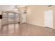 Open living area with vaulted ceilings, neutral paint, tile flooring, and a chandelier at 1858 N 128Th Dr, Avondale, AZ 85392