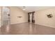 Open living room with neutral paint, tile flooring, a vaulted ceiling, and large window at 1858 N 128Th Dr, Avondale, AZ 85392