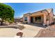 Beautiful home with a covered patio area, manicured landscaping, and a concrete patio at 20017 N Cielo Ct, Surprise, AZ 85374