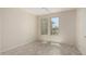 Bedroom with a ceiling fan, tile flooring, and window providing natural light at 20017 N Cielo Ct, Surprise, AZ 85374