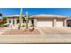 Charming single-story home with desert landscaping and a three-car garage at 20017 N Cielo Ct, Surprise, AZ 85374