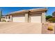 Spacious three-car garage with ample parking and a well-maintained driveway at 20017 N Cielo Ct, Surprise, AZ 85374