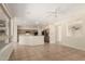 Open-concept kitchen and living area with ample counter space, stainless steel appliances, and tile flooring at 20017 N Cielo Ct, Surprise, AZ 85374