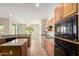 Open kitchen with laminate countertops, modern appliances, and tile flooring at 20017 N Cielo Ct, Surprise, AZ 85374