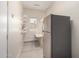 Storage room with shelving, a refrigerator, and a work table for convenience at 20017 N Cielo Ct, Surprise, AZ 85374