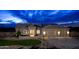Stunning exterior view of this one-story home displaying its well manicured lawn and multi-car garage at 217Xx W Buck Ln, Wittmann, AZ 85361