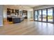 Bright, open-concept living area featuring sleek tiled floors and a modern kitchen with stainless steel appliances at 217Xx W Buck Ln, Wittmann, AZ 85361