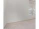 Vacant bedroom with carpet flooring, window with plantation shutters, and neutral walls at 29670 N 46Th St, Cave Creek, AZ 85331