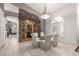 Elegant dining room featuring stone accents, wine storage, and modern lighting at 29670 N 46Th St, Cave Creek, AZ 85331