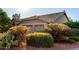 Exterior of Scottsdale home featuring a two-car garage, tile roof, and desert landscaping at 29670 N 46Th St, Cave Creek, AZ 85331