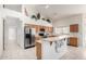 Open kitchen featuring stainless steel appliances, breakfast bar and eat-in kitchen at 29670 N 46Th St, Cave Creek, AZ 85331