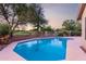 Backyard pool surrounded by desert landscaping, tall trees and with golf course views at 29670 N 46Th St, Cave Creek, AZ 85331