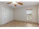 Bedroom featuring a closet, window, and tiled floor at 3433 E Betty Elyse Ln, Phoenix, AZ 85032