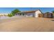 View of front exterior with desert landscaping and an attached garage, freshly painted at 3433 E Betty Elyse Ln, Phoenix, AZ 85032