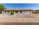 Charming single-story home features a low-maintenance desert landscape, attached garage and freshly painted exterior at 3433 E Betty Elyse Ln, Phoenix, AZ 85032