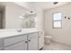 The bathroom features a large vanity, a toilet, a window, and a shower at 36025 W Santa Clara Ave, Maricopa, AZ 85138