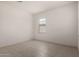 Neutral bedroom with tile flooring, white walls and bright natural light at 36025 W Santa Clara Ave, Maricopa, AZ 85138