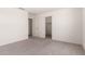 Spacious bedroom with neutral carpeting and convenient access to closet and other rooms at 36025 W Santa Clara Ave, Maricopa, AZ 85138