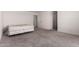A carpeted bedroom features white walls, a doorway, and a mattress at 36025 W Santa Clara Ave, Maricopa, AZ 85138